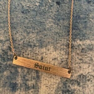 Gold Bar Necklace with 'Saint' Engraving